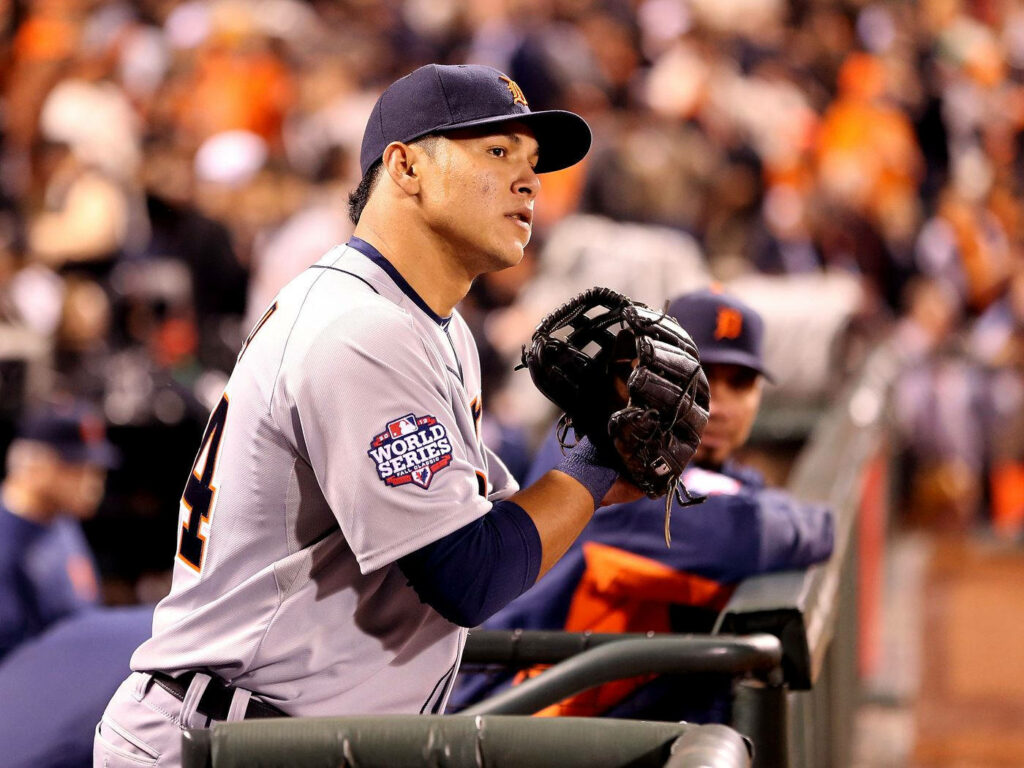 Avisail Garcia in Detroit Tigers uniform watching intense World Series game from dugout railing Wallpaper