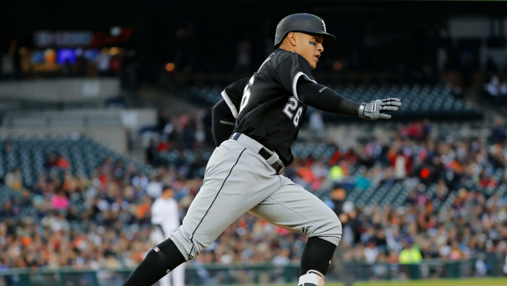 Avisail Garcia sprinting on baseball field focused in team uniform with blurred stadium background Wallpaper