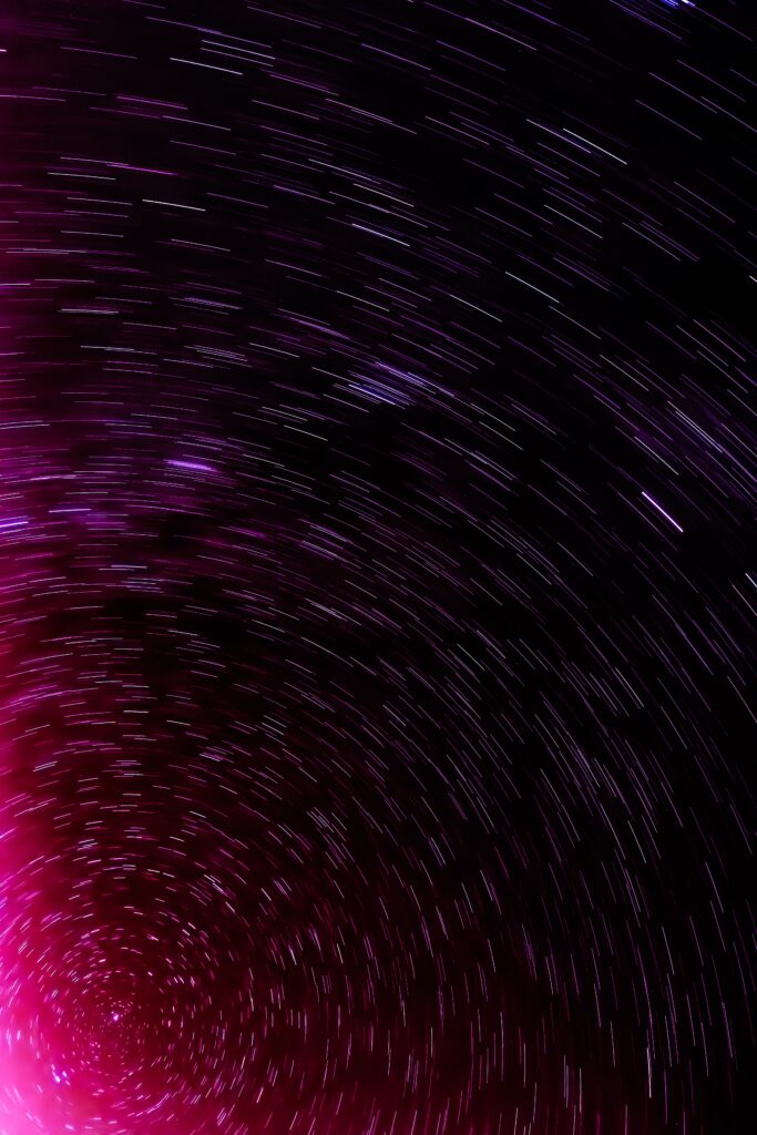 Stunning Night Sky Wallpaper: Long-Exposure Star Trails & Cosmic Hues