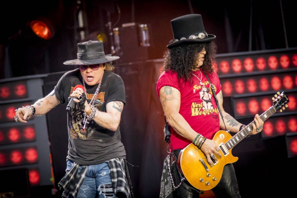 Axl Rose and Slash live on stage in San Francisco with red lights Guns N Roses wallpaper background