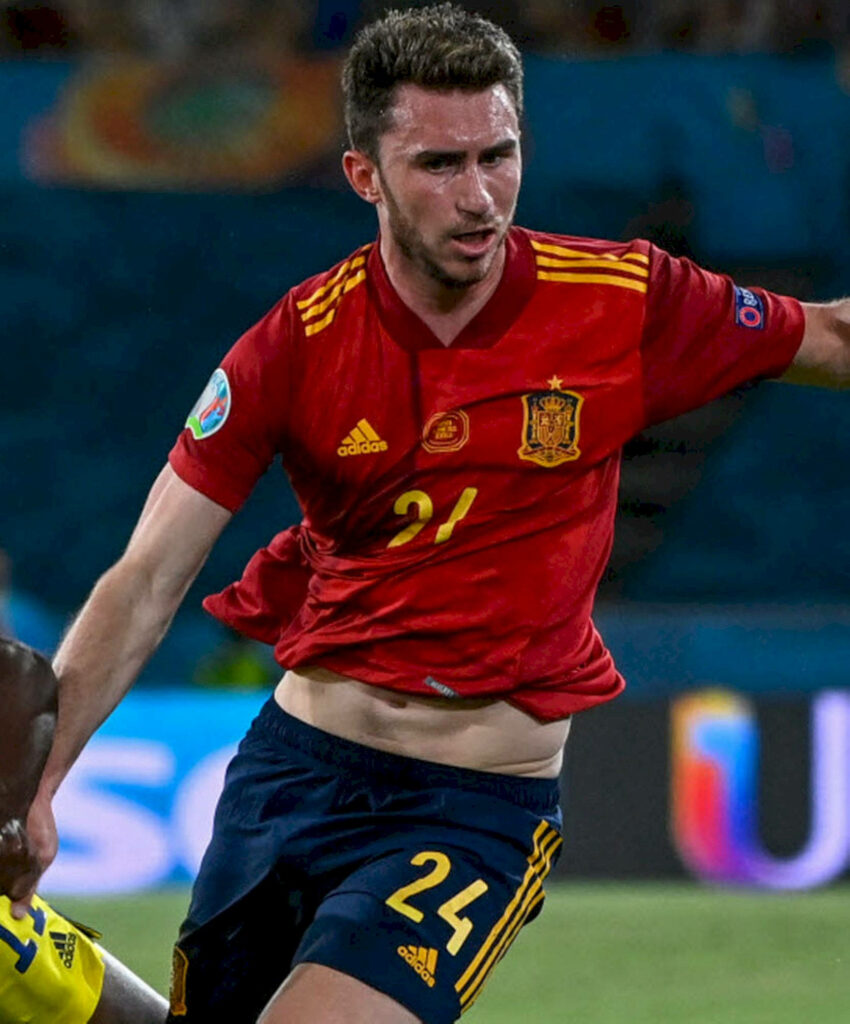 Aymeric Laporte in Spain football kit showing focus during intense national team match wallpaper