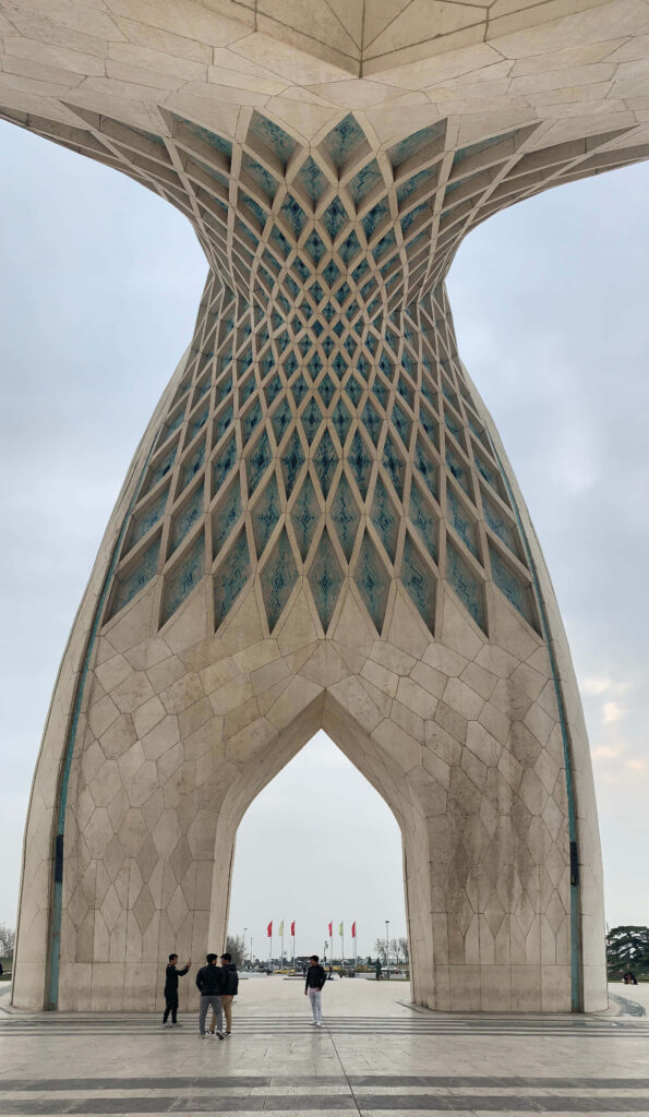 Underside view of Azadi Tower geometric patterns Tehran architecture iPhone wallpaper background