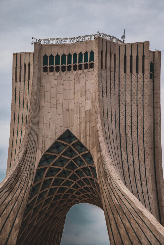 Azadi Tower Tehran dramatic dark stormy clouds architecture wallpaper for iPhone background