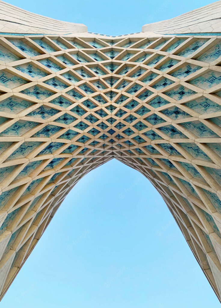 Azadi Tower Tehran wallpaper with intricate geometric patterns and soaring arches blue sky