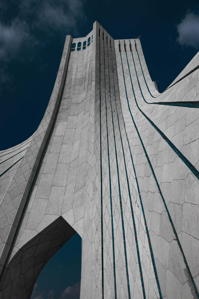 Azadi Tower Tehran gray modern architecture against deep blue sky wallpaper background