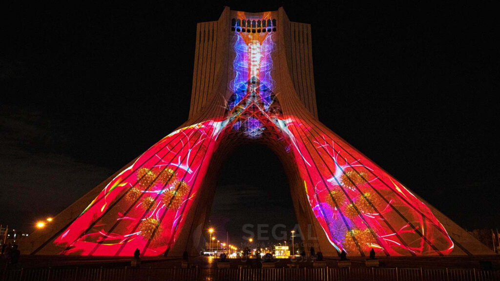 Azadi Tower Tehran illuminated by red lights and projections night sky wallpaper background