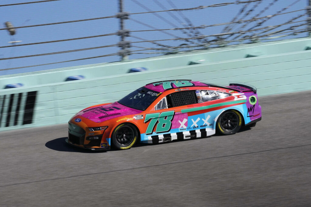B.J. McLeod drives vibrant zombie-themed race car number 78 with bold graphics on track Wallpaper