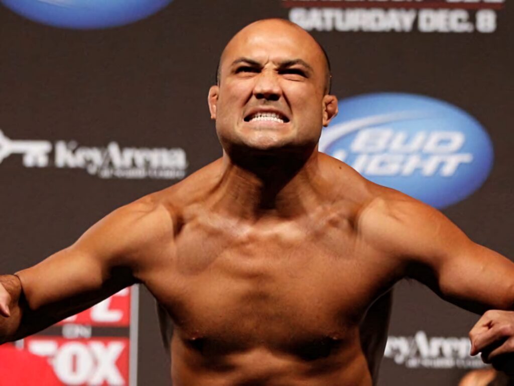B.J. Penn flexes muscles with intense determination at MMA weigh-in against wallpaper background
