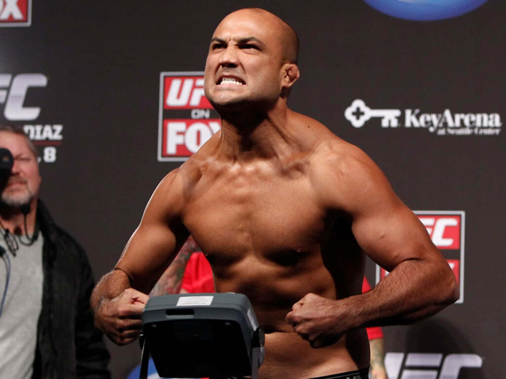 B.J. Penn flexing muscles showing intensity at UFC weigh-in with fierce determination wallpaper