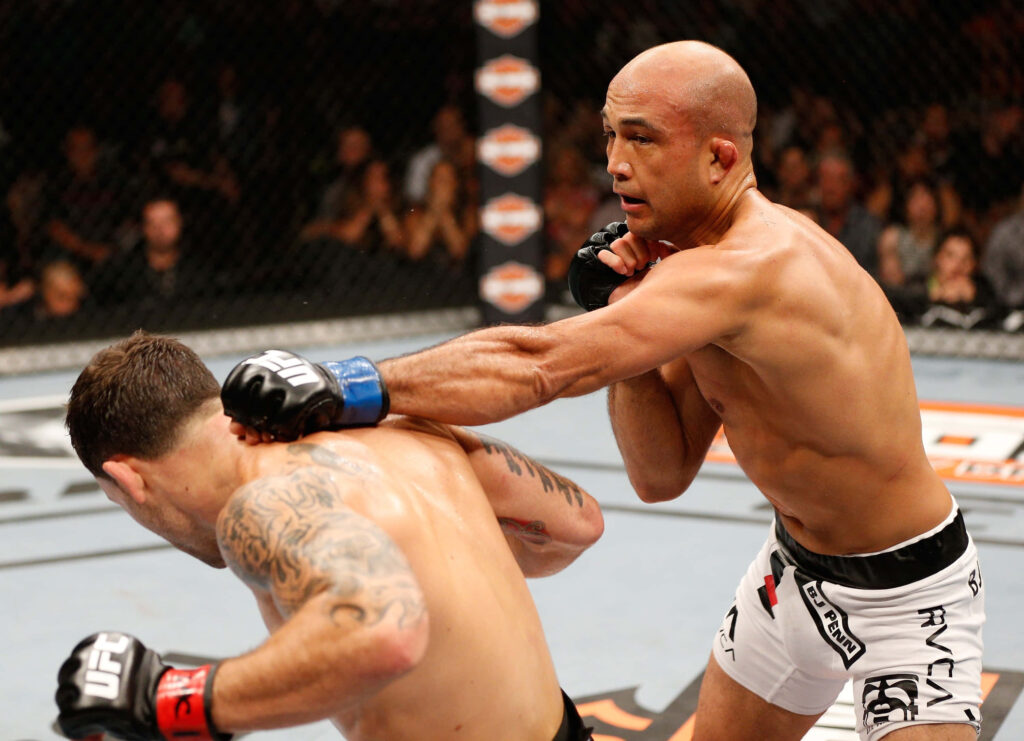B.J. Penn lands a powerful punch in UFC octagon showcasing intense MMA action wallpaper