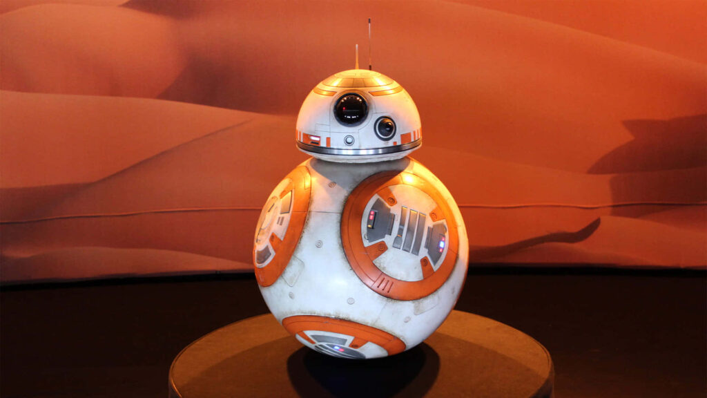 BB-8 Star Wars droid wallpaper with warm sandy background showcasing orange white design
