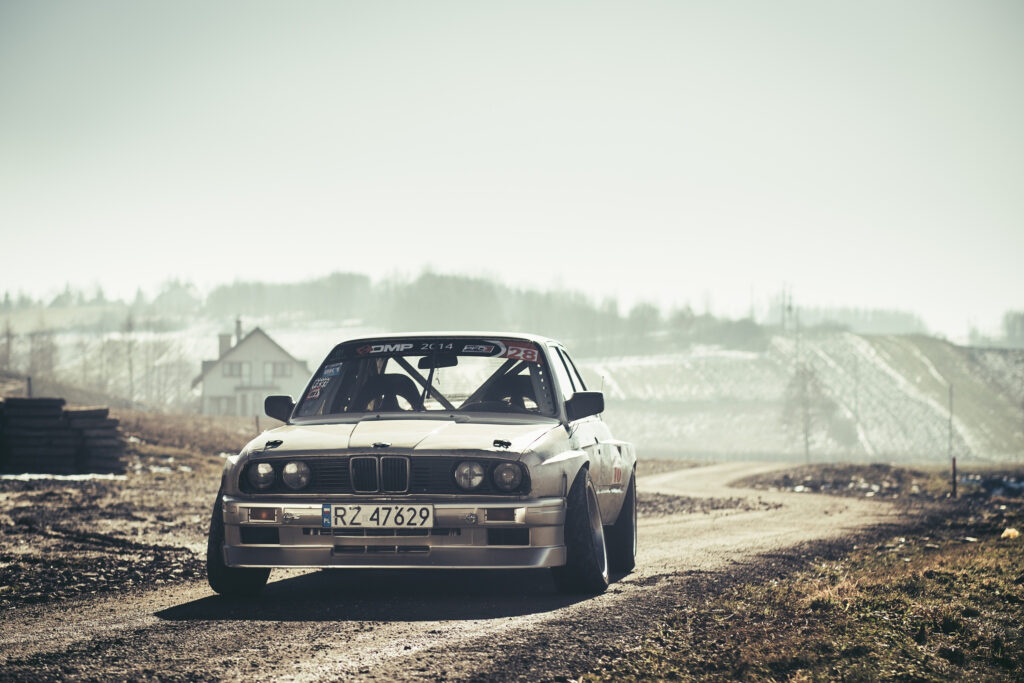 Classic BMW E30 on Open Road: Sporty Design & Drift Appeal Wallpaper