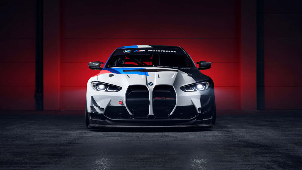 BMW M Motorsport race car front view dramatic red lighting sleek aggressive aerodynamic design wallpaper