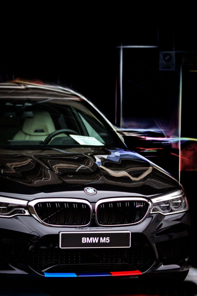 BMW M5 Android wallpaper featuring bold front design and luxury details on modern background