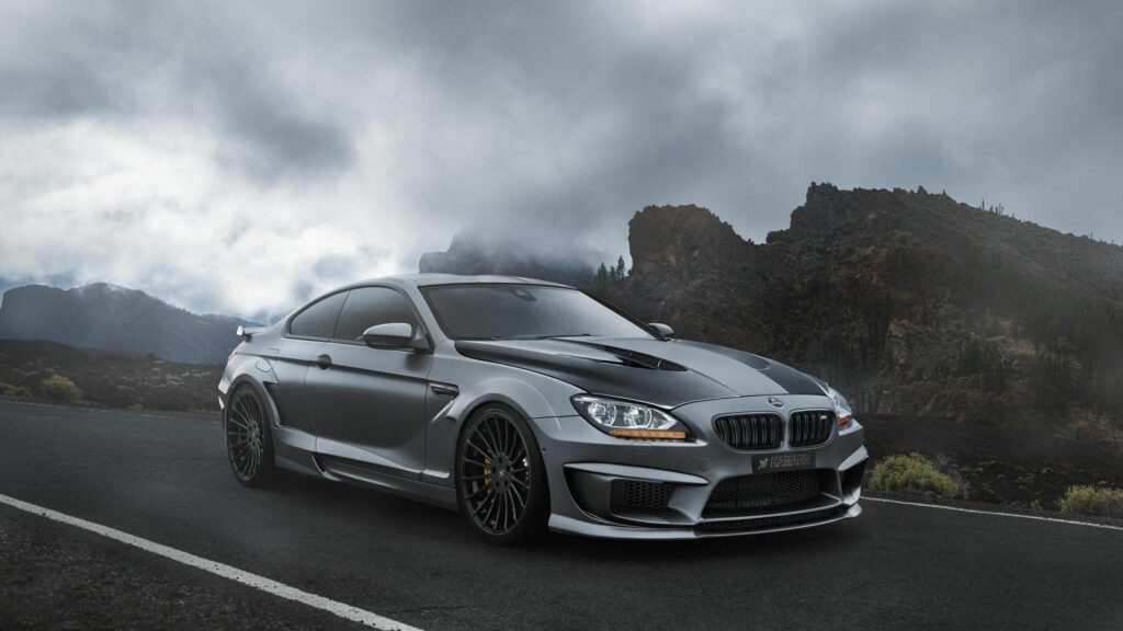 Sleek BMW M6 F13 Wallpaper: Luxury & Adventure in Mountain Mist