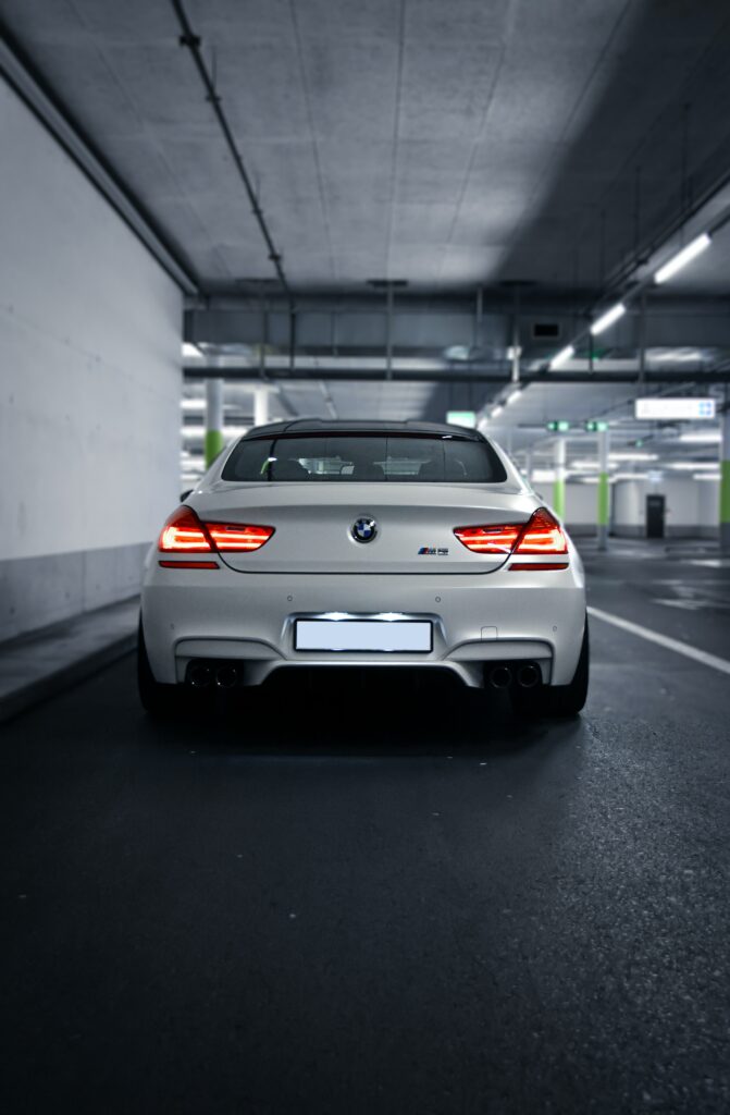 Sleek BMW M6 Wallpaper: Rear View in Dramatic Lighting