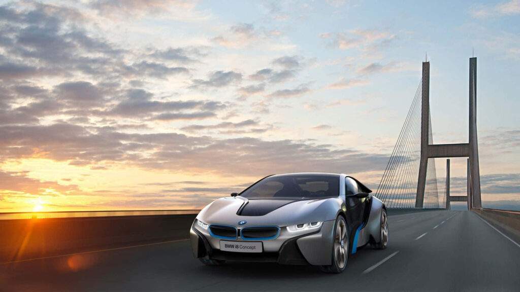 BMW i8 electric sports car driving on modern bridge at sunrise futuristic design wallpaper