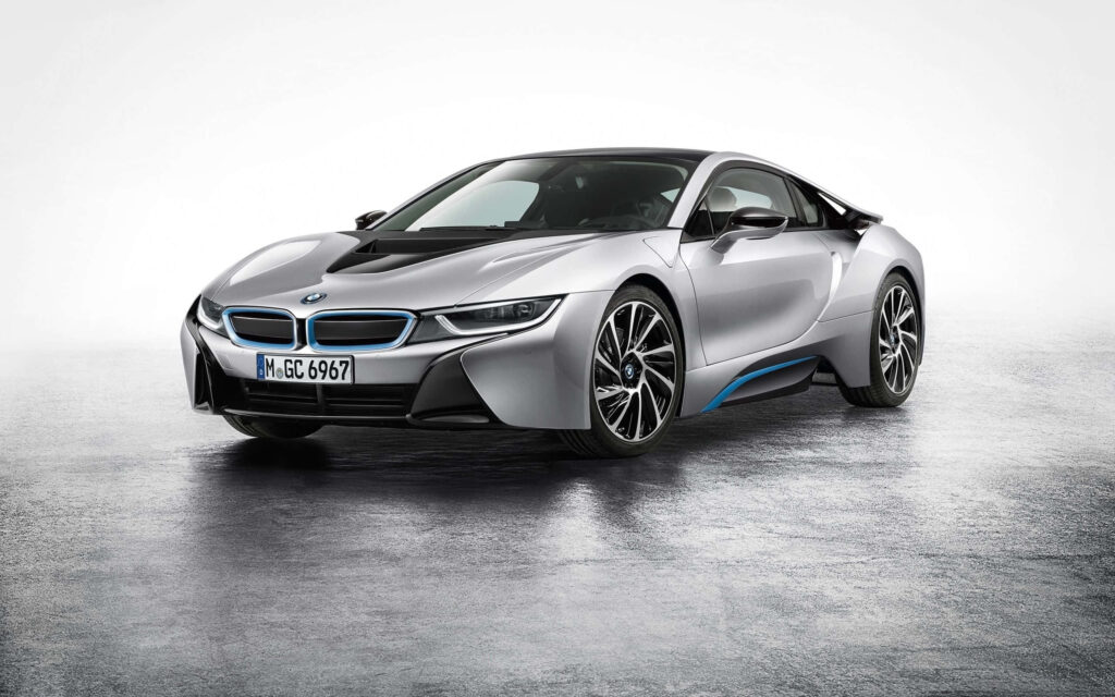 BMW i8 Hybrid Coupé sleek futuristic design on reflective surface showcasing hybrid technology Wallpaper