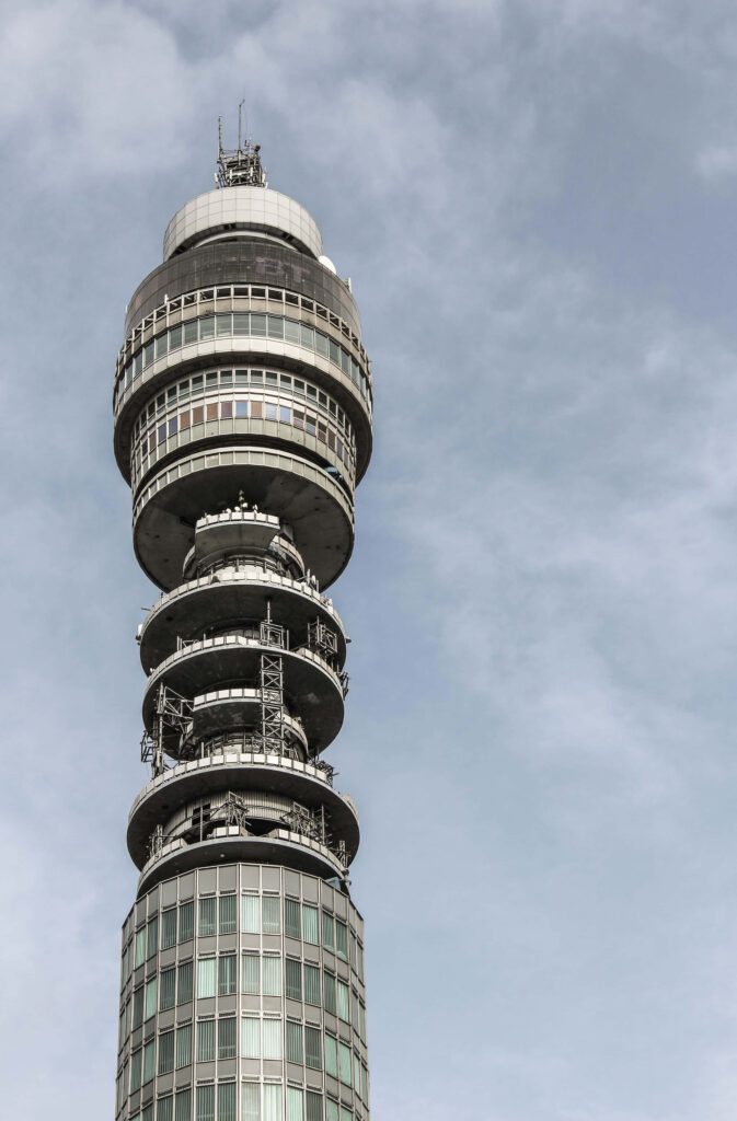 BT Tower phone wallpaper featuring sleek modern architecture against a soft blue sky background