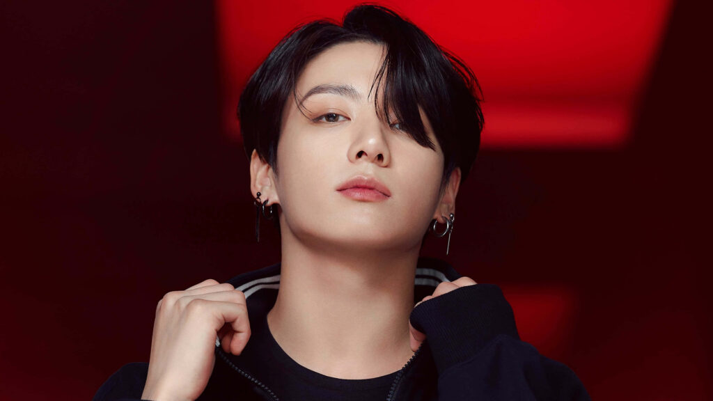 Bold Red Wallpaper: Jung Kook's Stunning Confident Photoshoot