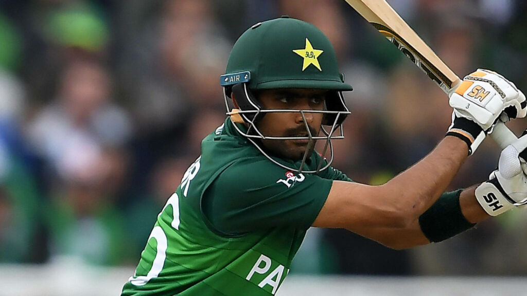 Babar Azam focused playing cricket shot dynamic wallpaper background vibrant sports image
