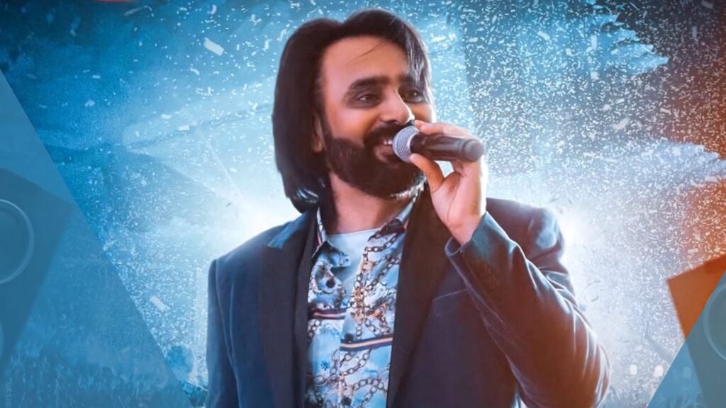 Babbu Maan passionately singing on vibrant stage background energetic performance wallpaper