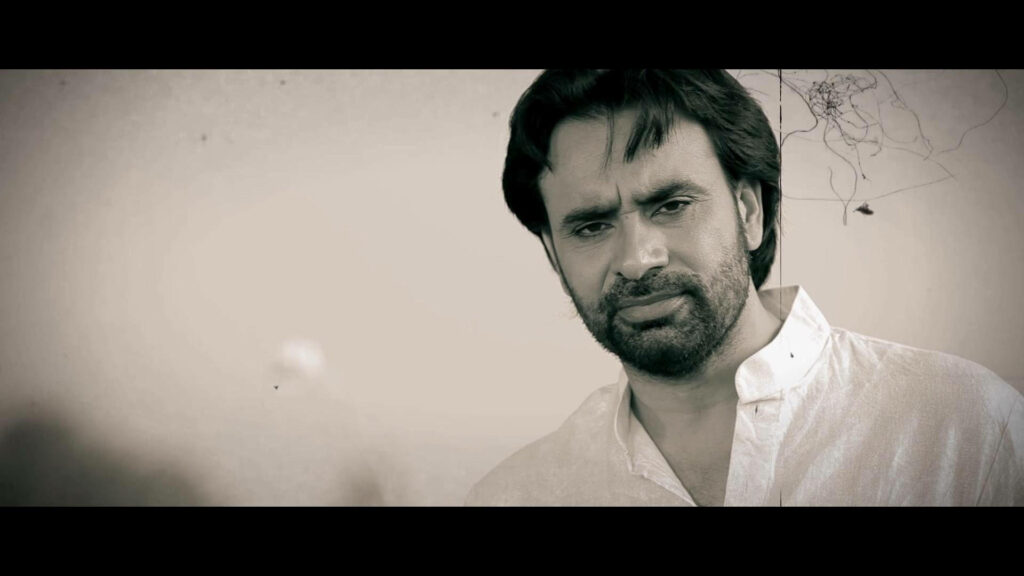 Babbu Maan intense gaze monochrome wallpaper traditional attire striking timeless background