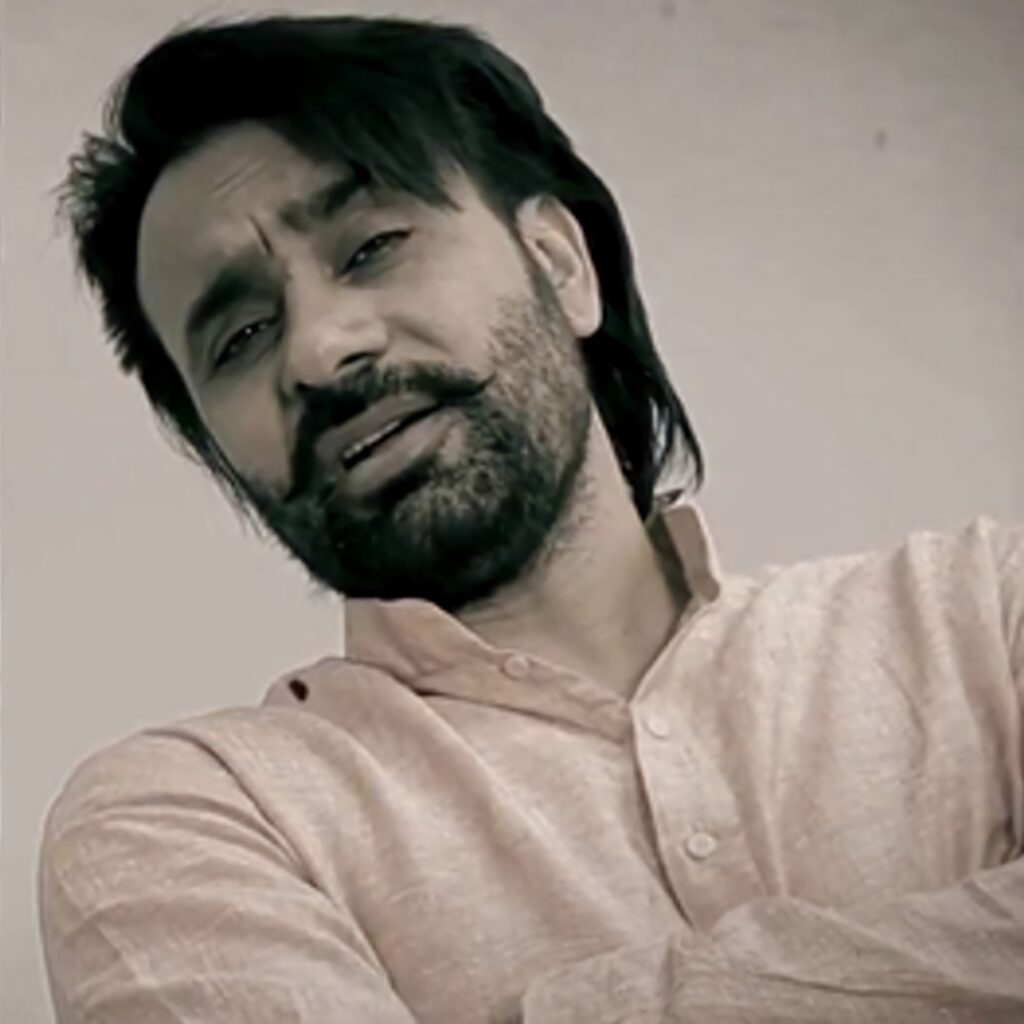 Babbu Maan candid portrait wallpaper confident expression Indian celebrity fans background