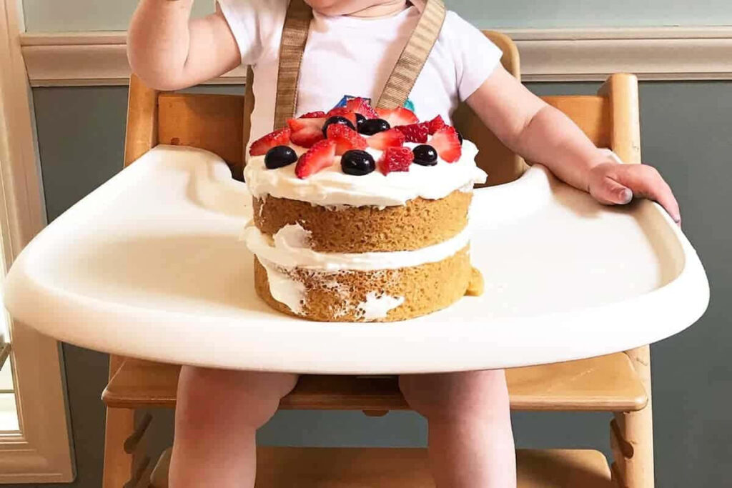 Adorable Baby Cake Smash in High Chair - Sweet Fun Wallpaper