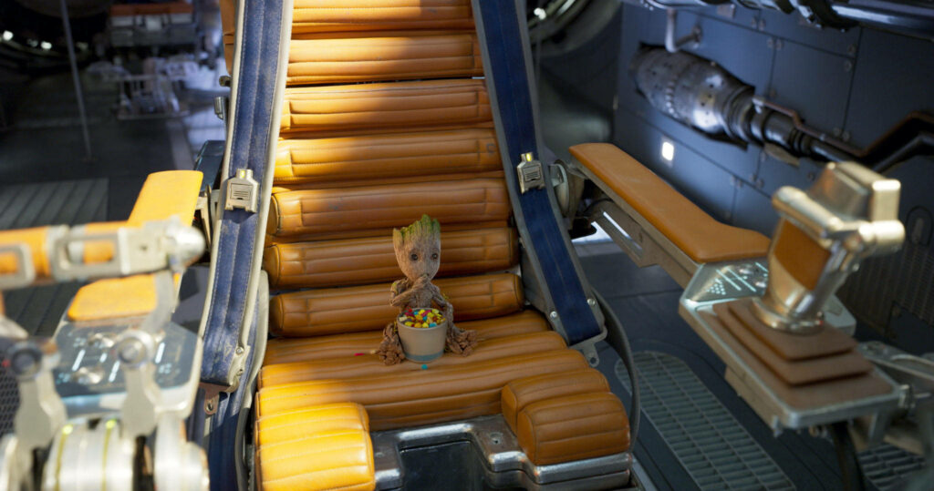 Galactic Munchies: Baby Groot Feasts in Spacecraft Wallpaper