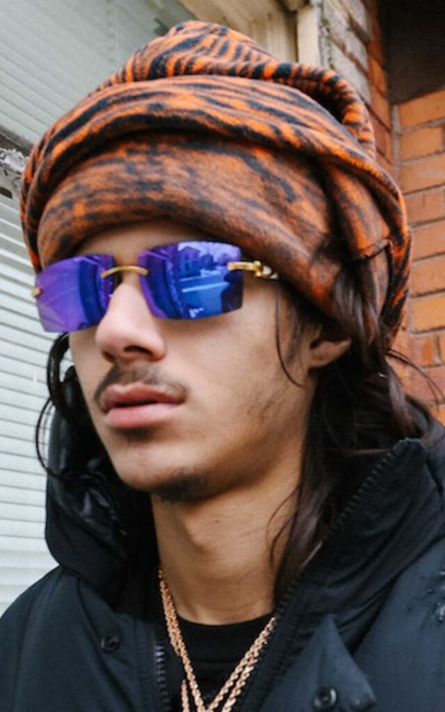 BabyTron rapper wearing blue reflective sunglasses and patterned headwrap street style wallpaper