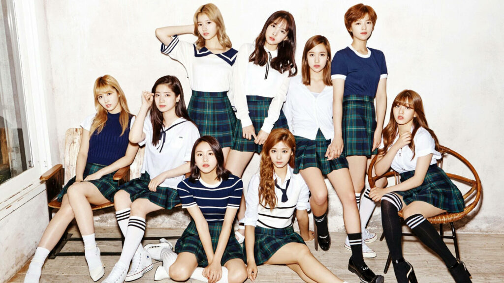 Back to School with Twice: The Ultimate Comeback Wallpaper Featuring Korean Pop Sensation in Uniforms