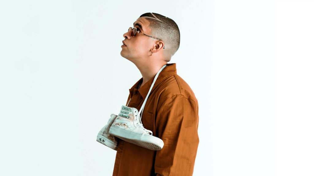 Signature Style: Minimalist Portrait of Bold Bad Bunny in Vibrant Orange Wallpaper