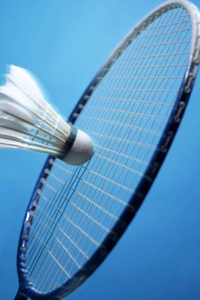 Badminton Racket-Shuttlecock Blue Background Wallpaper