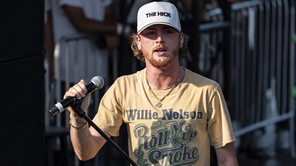 Bailey Zimmerman country singer performing live on stage wearing cap and casual t-shirt Wallpaper