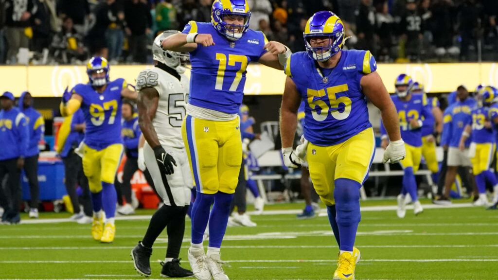 Baker Mayfield celebrates touchdown pass with teammate in exciting Los Angeles Rams game wallpaper