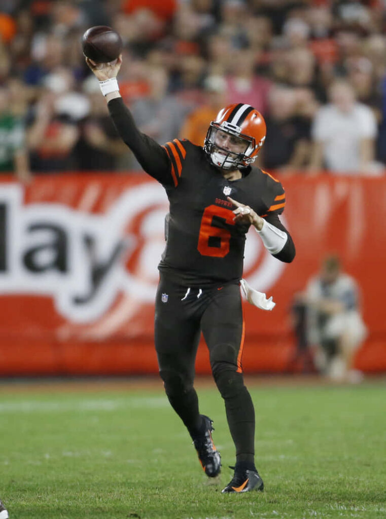 Baker Mayfield throwing pass in Cleveland Browns uniform dynamic football action wallpaper