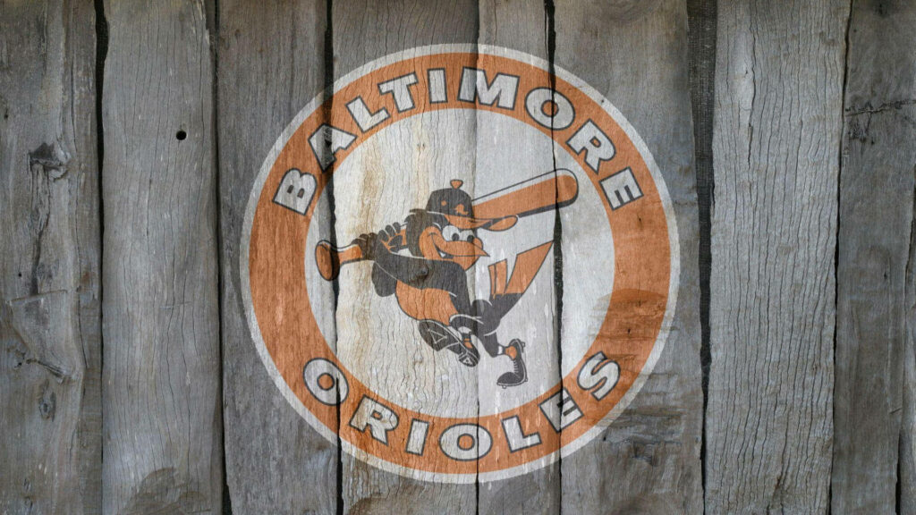 Baltimore Orioles logo on rustic wooden background classic baseball fan wallpaper design