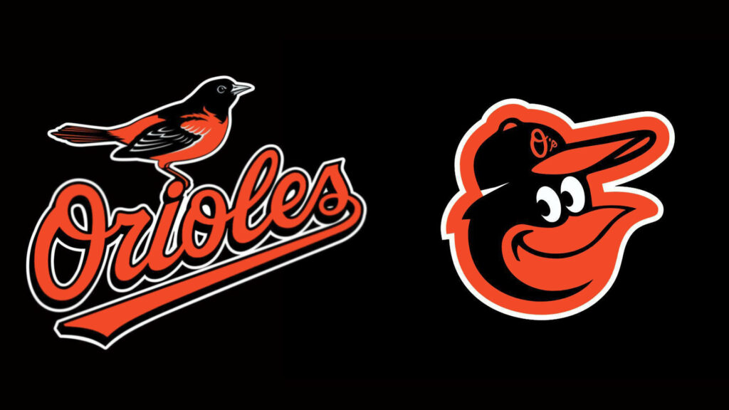 Baltimore Orioles wallpaper with classic script logo and smiling cartoon bird head on black background