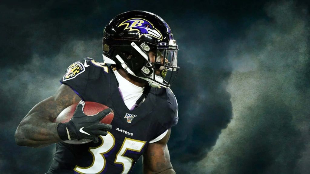 Baltimore Ravens Gus Edwards running back jersey 35 dynamic action dark stormy NFL wallpaper