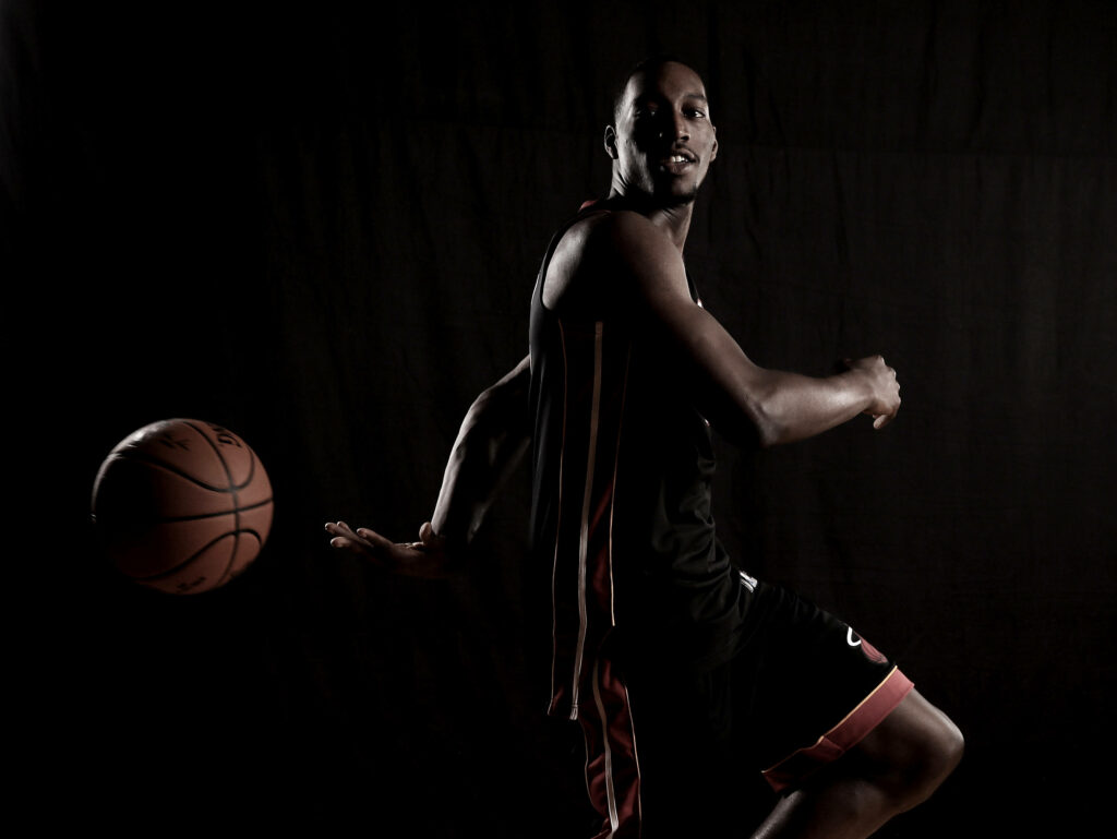 Bam Adebayo intense basketball action pose dark studio background dynamic sports wallpaper
