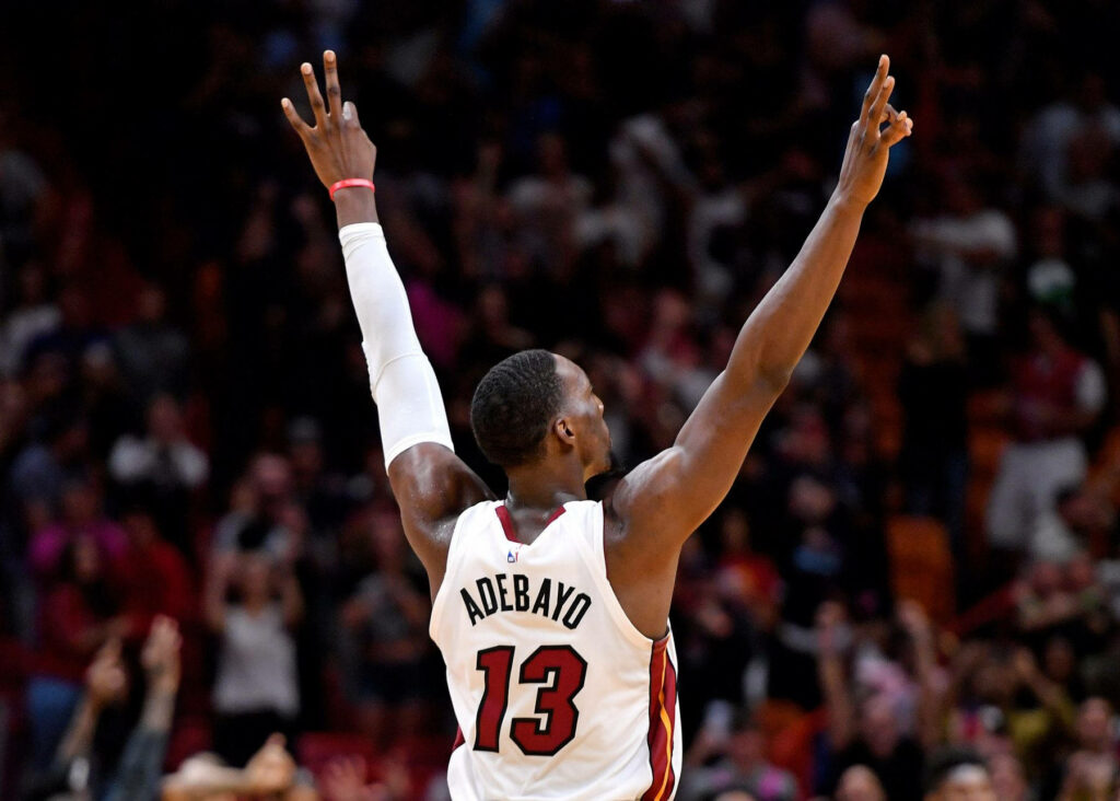 Bam Adebayo Miami Heat celebrates with raised arms vibrant crowd basketball action wallpaper