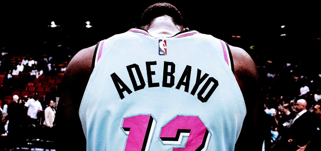 Back view of Bam Adebayo in Miami Heat jersey number 13 under bright arena lights wallpaper