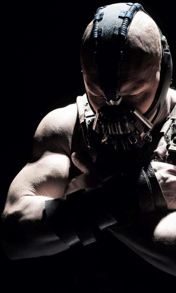 Bane from DC Comics muscular build iconic mask dramatic low light wallpaper background image