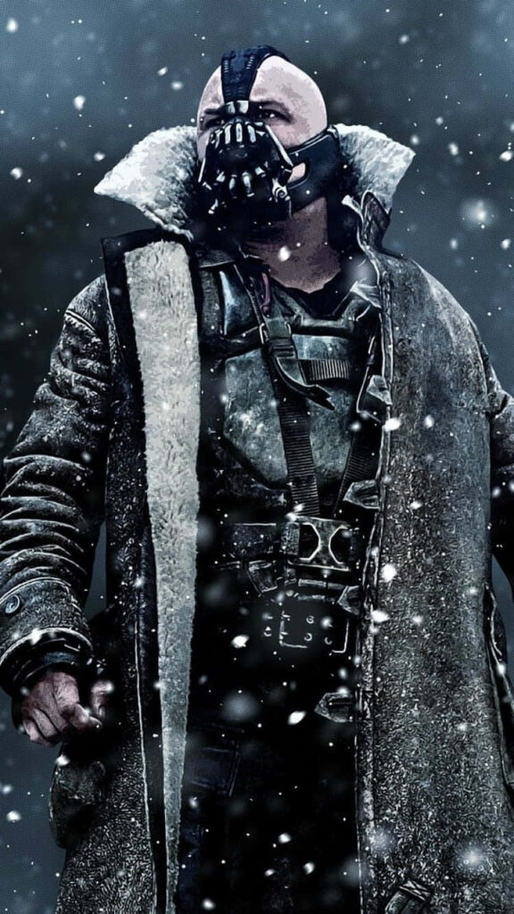 Bane from DC Comics in heavy winter coat and mask standing powerfully in snowy scene background Wallpaper