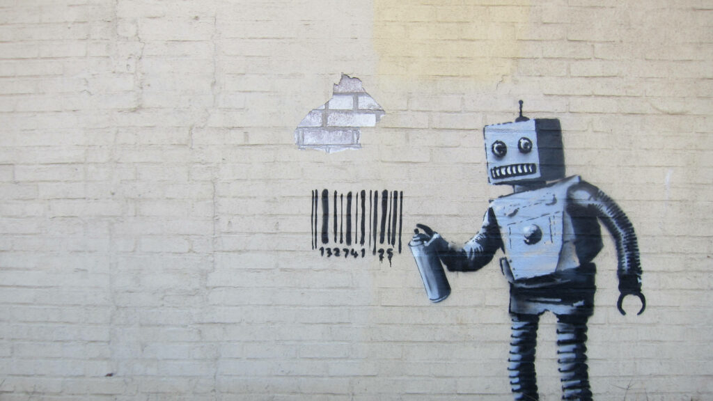 Banksy street art robot spraying barcode on brick wall urban tech consumerism wallpaper