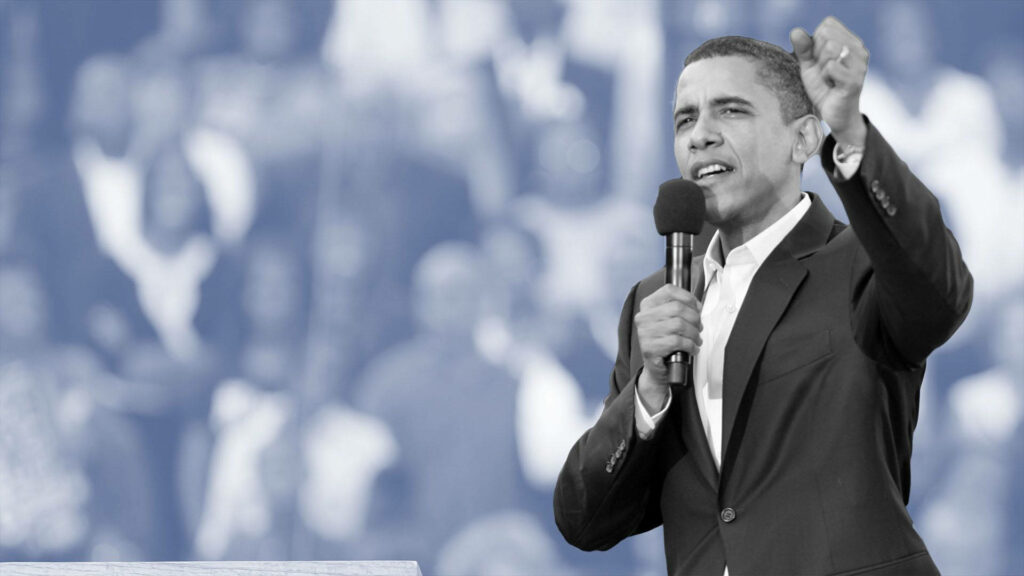 Greyscale wallpaper of Barack Obama speaking passionately with blurred crowd background