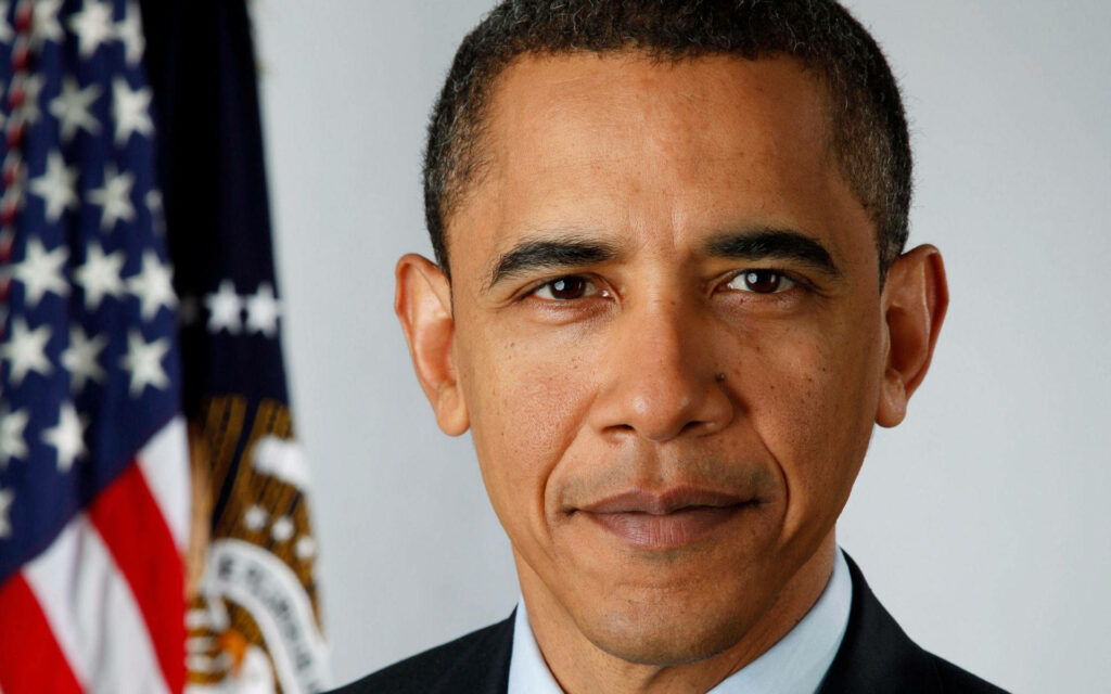 Close-up portrait of President Barack Obama with American flag background showing calm confidence Wallpaper