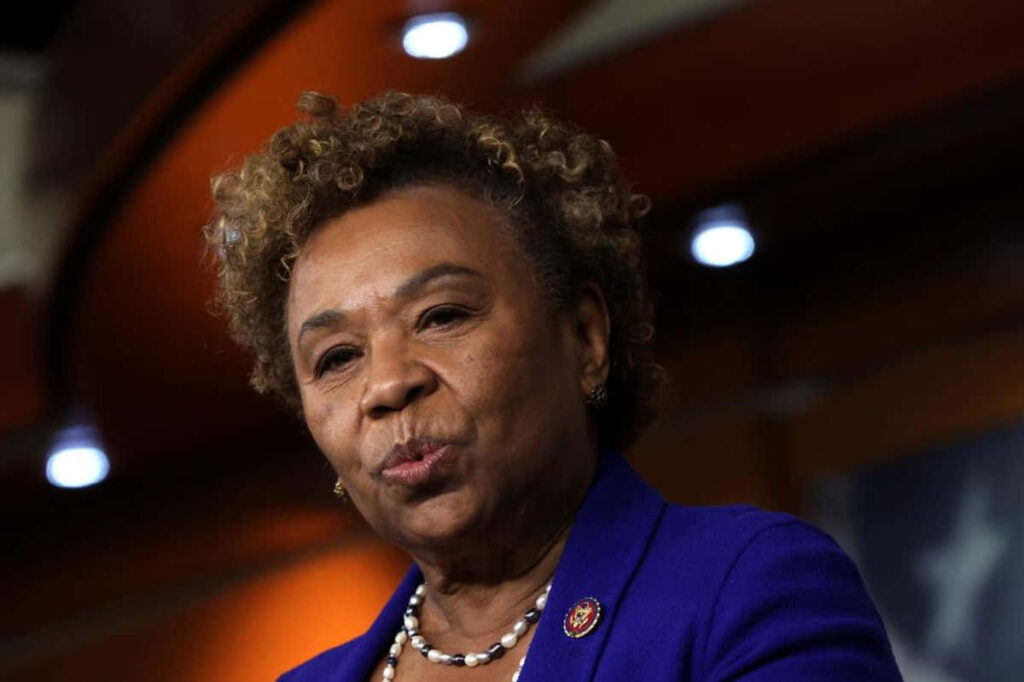 U.S. Representative Barbara Lee in blue suit thoughtful pose inspiring reflective wallpaper background