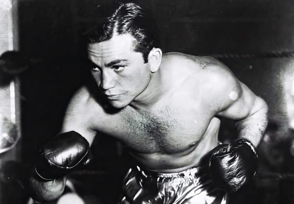Barney Ross black and white boxing pose wallpaper showcasing legendary fighter determination